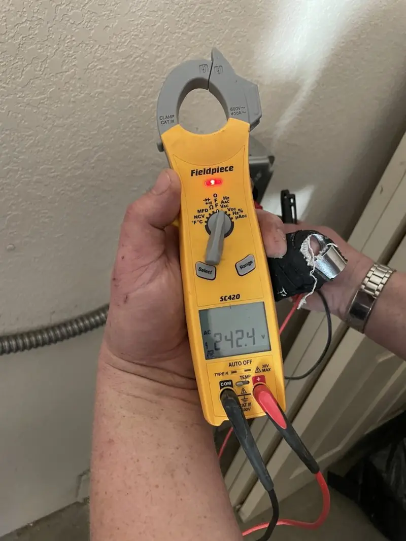 Voltage testing with clamp meter during Electrical Installation Services in Bluefield